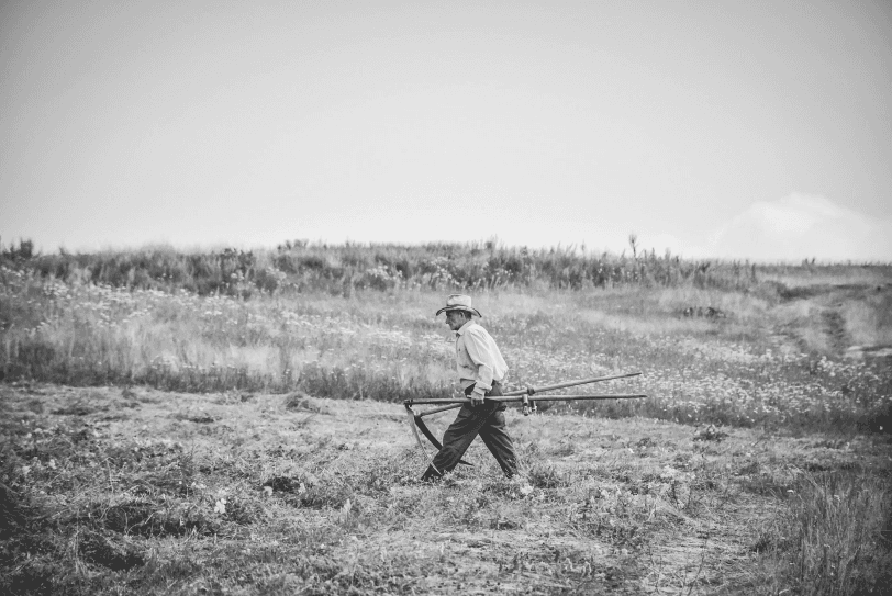 A farmer walking through a field